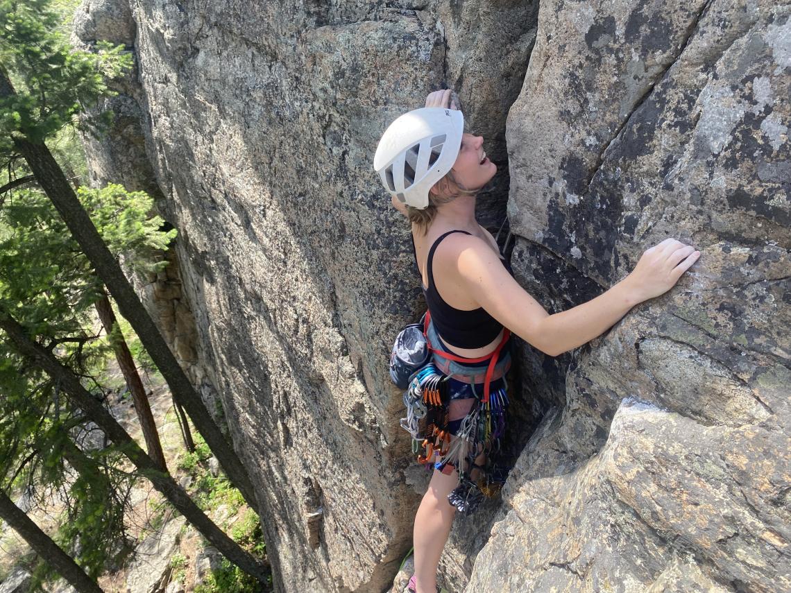 Sydney scales a rock face