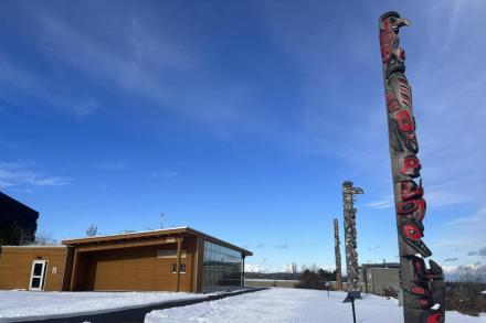 VIU's three totems outside Shq'apthut on the Nanaimo campus