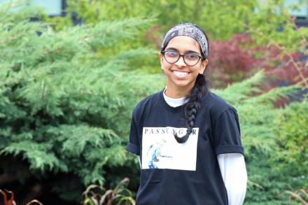 Becky stands in front of greenery at VIU's Nanaimo campus