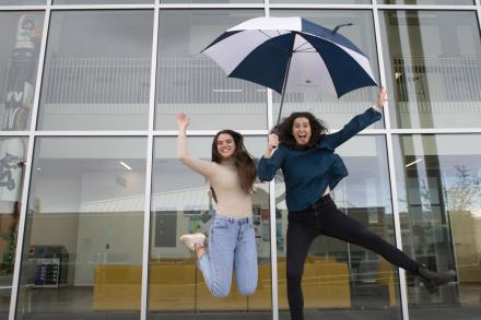 Kayla and Victoria jump in the air